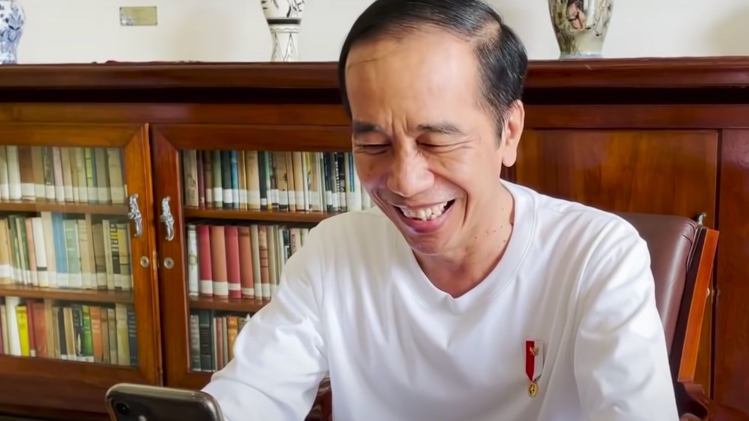 Indonesia’s President agrees to pardon professor who was jailed over WhatsApp message