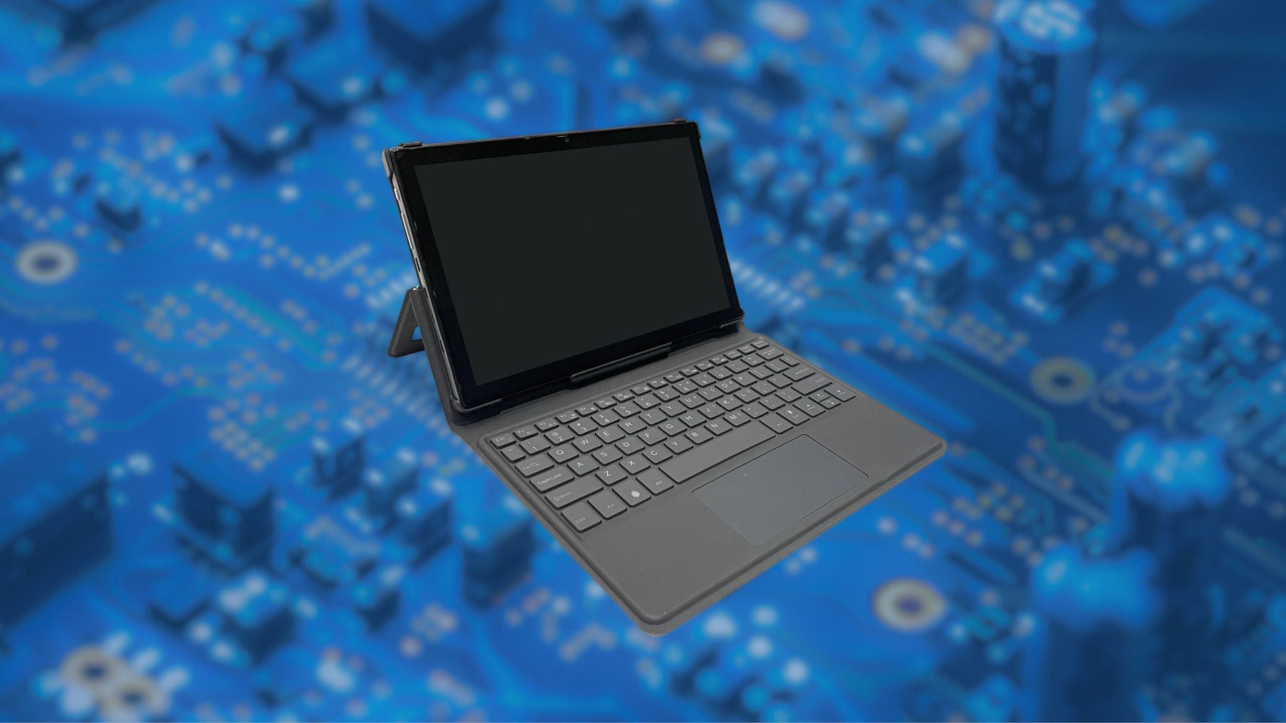 Tablet with keyboard case floating over a blurred blue electronic circuit board background