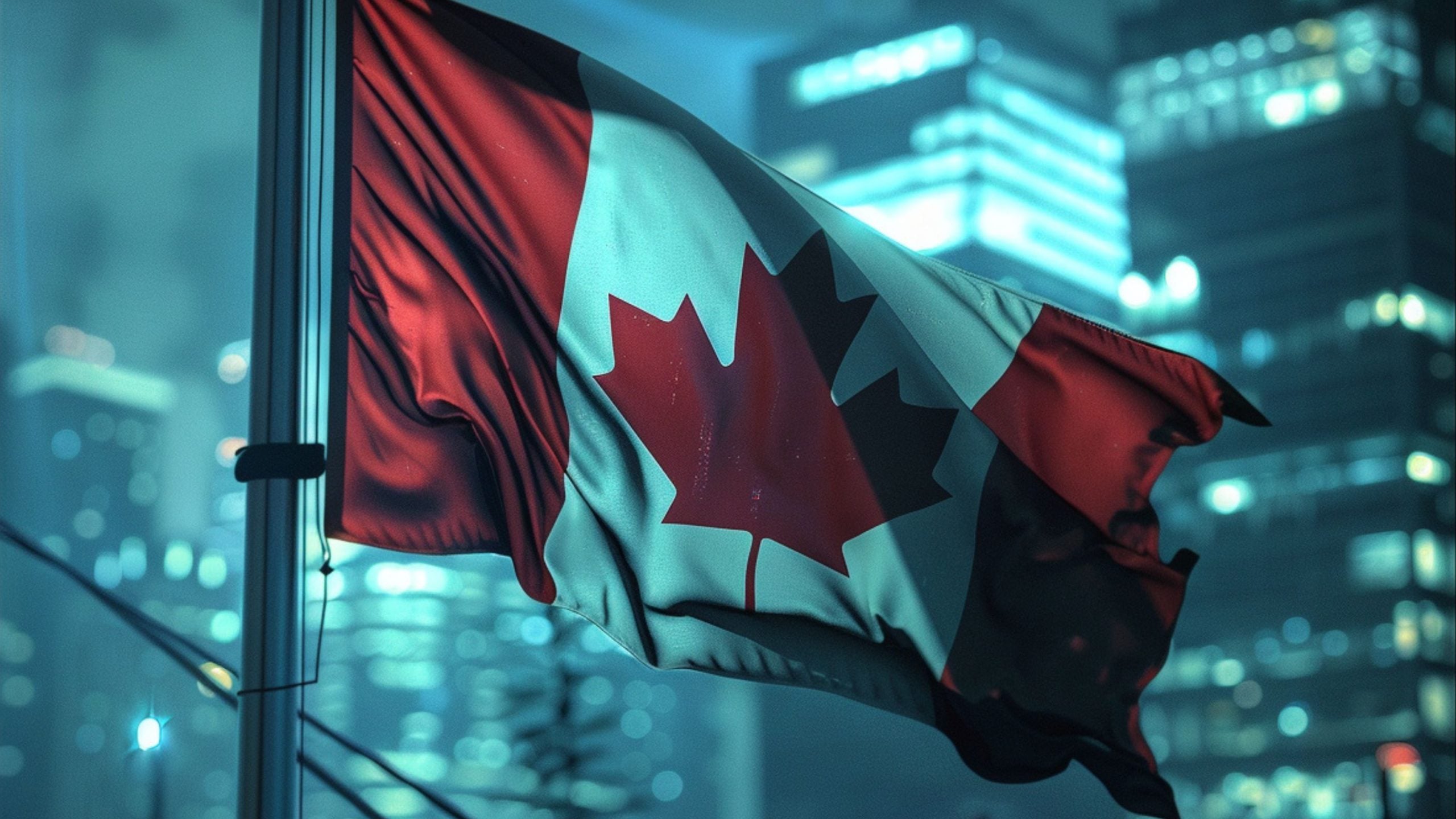 Canadian flag with a red maple leaf in the center, waving on a flagpole against a background of city lights and skyscrapers at night.