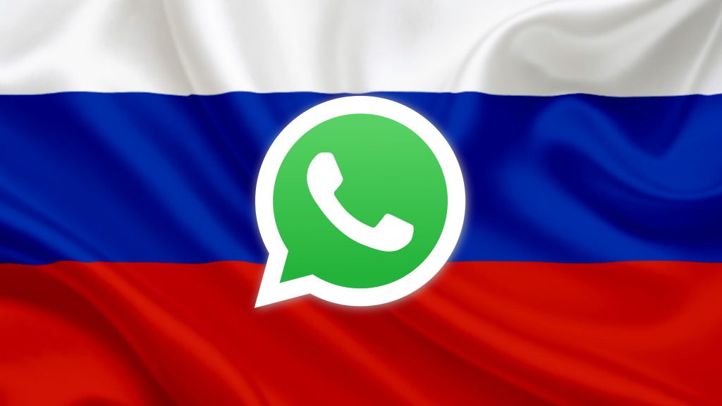A large green WhatsApp speech-bubble logo centered over a waving Russian flag showing horizontal white, blue, and red stripes.