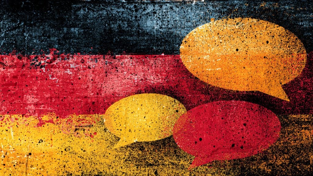 Abstract textured German flag colors with large yellow and red speech-bubble shapes and paint splatter effects