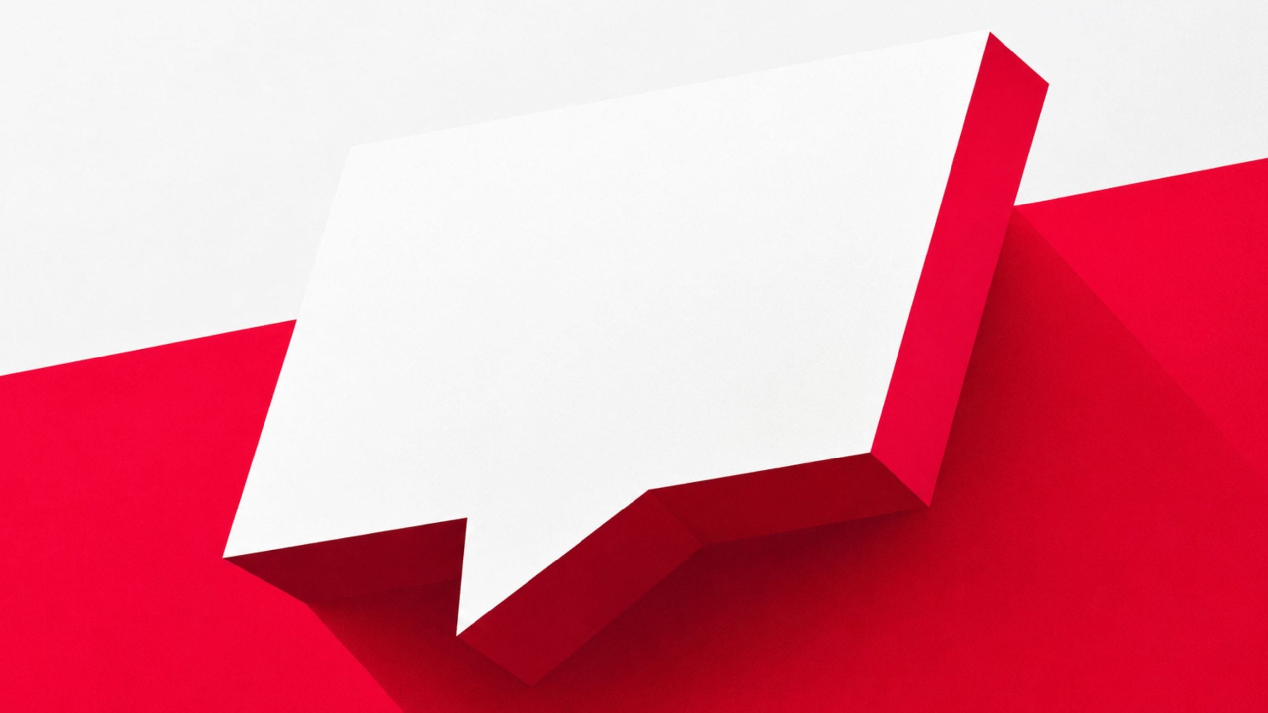 Large white paper speech bubble casting a shadow over bold red geometric background, tilted diagonally across the frame.